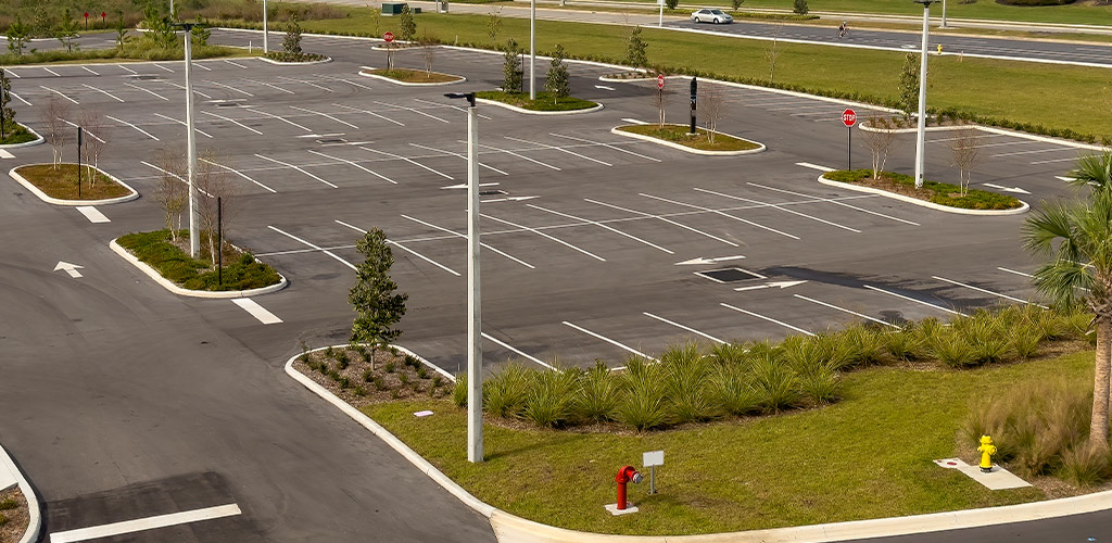 Maintained parking lot landscape island with shrubs and mulch at a Birmingham Alabama commercial property